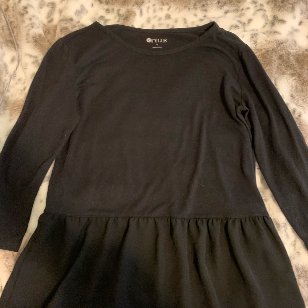 Black blouse with sheer bottom.